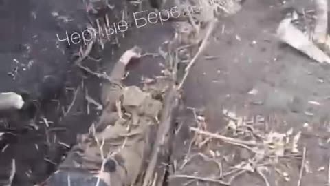 A captured fascist supporter with dead carcasses of crests and trophies