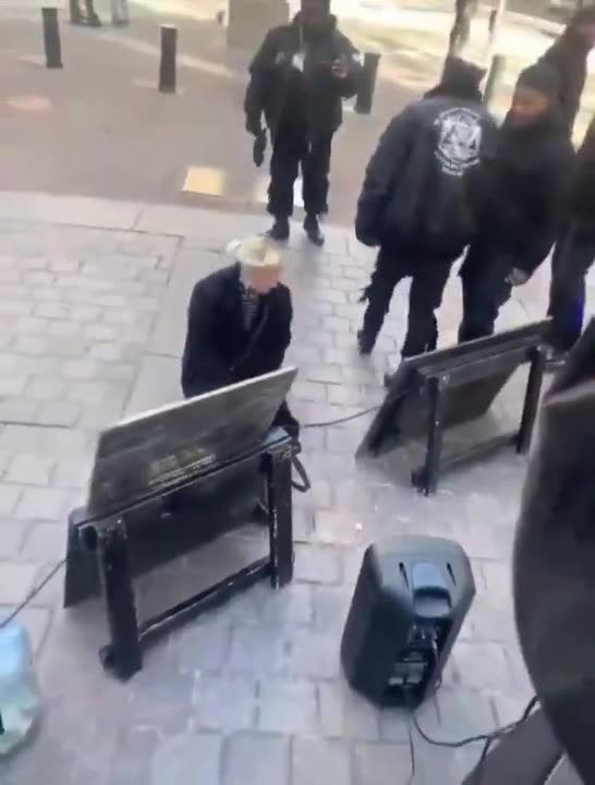White woman kissing the shoes of negros