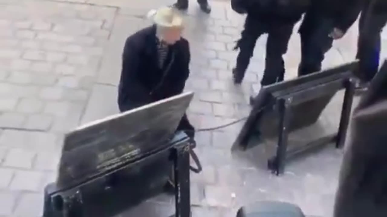 White woman kissing the shoes of negros