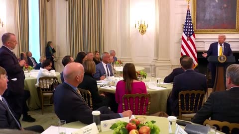 United States president Donald Trump talks to governors