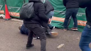 Bunch of forign tfl security guards set about English lad who was peacefully