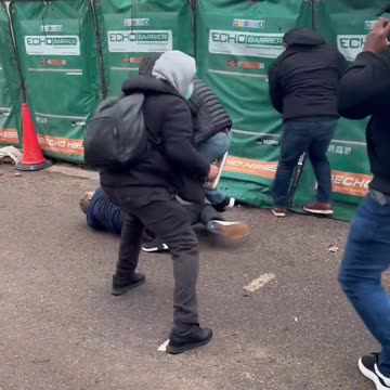 Bunch of forign tfl security guards set about English lad who was peacefully
