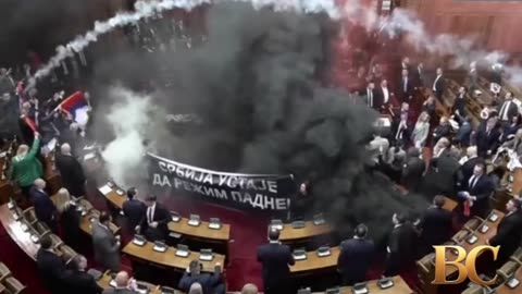 Serbian parliament erupts into chaos as opposition hurl smoke bombs and flares