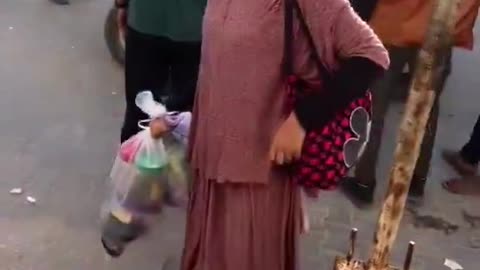 Children carrying other dead or dying children in Gaza