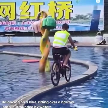 Crossing the pool with a bike.hd