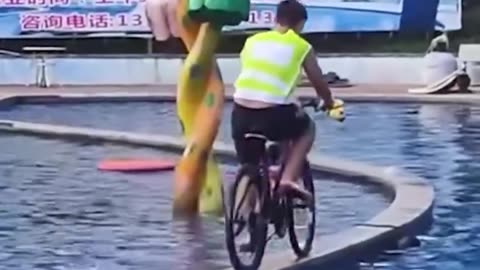 Crossing the pool with a bike.hd