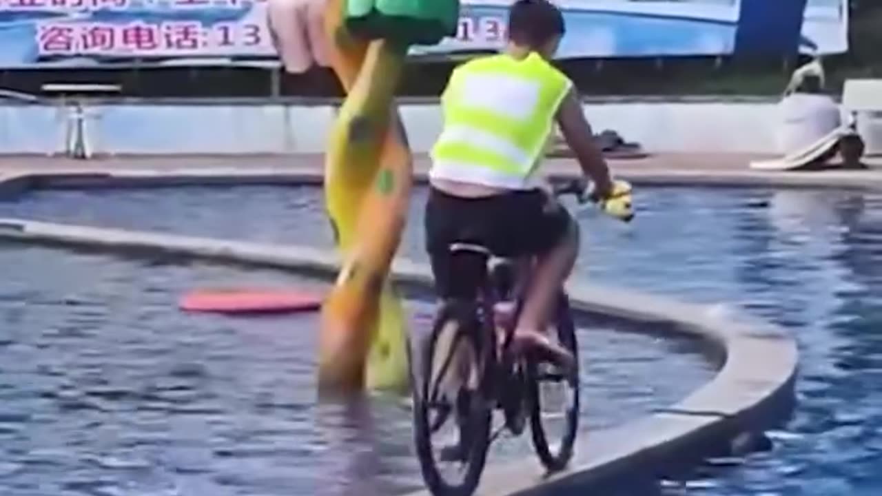 Crossing the pool with a bike.hd