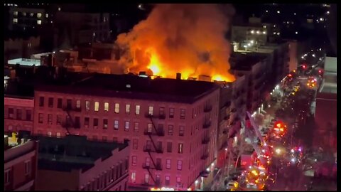 The NYFD is battling a massive 4-alarm blaze at an apartment building in Manhattan