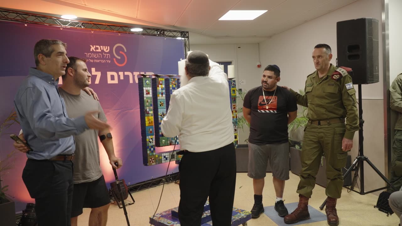 IDF: The Chief of the General Staff Lights Hanukkah Candles With Injured