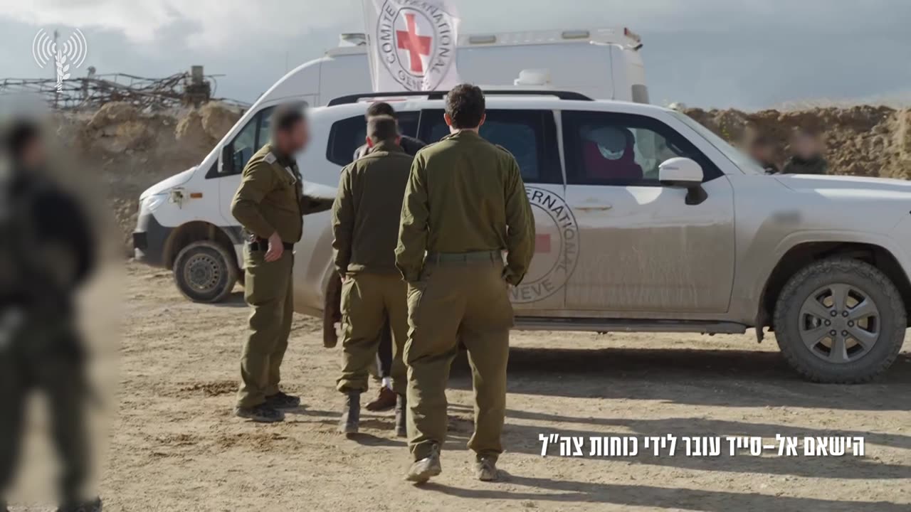 Released hostage Hisham al-Sayed is seen being handed over to IDF troops in