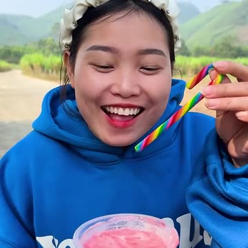 Kind girl eating strawberry ice cream