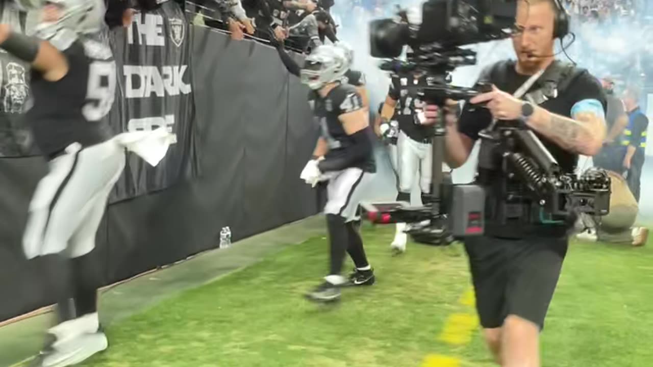 Las Vegas Raiders running out onto the field for NFL Sunday in Las Vegas