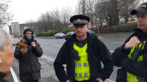 A Scottish pensioner is approached by system pigs for standing in the vicinity of an abortion clinic