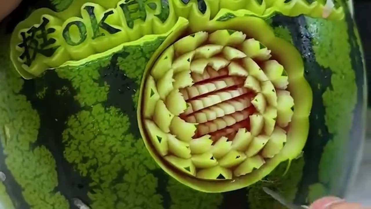 Check out this skilled artist make a watermelon masterpiece!.hd