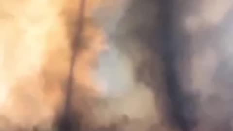 Fire tornadoes over charred land in California