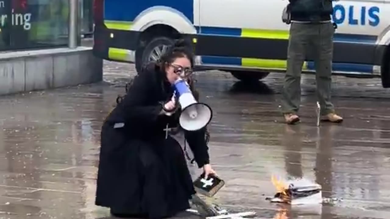Woman burns Koran in Sweden_