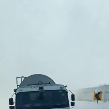 Terrifying moment as stranded motorists face a powerful avalanche.