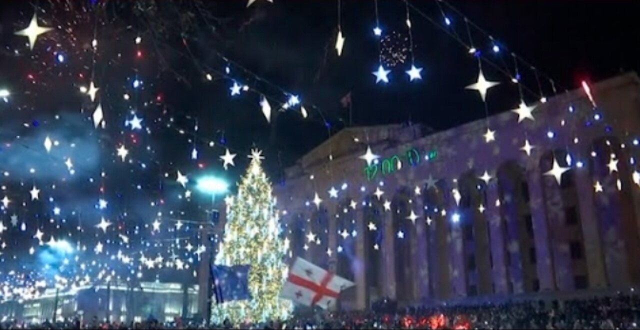 Thousands celebrate new year in front of parliament in Georgia capital as protests continue