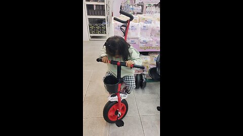 baby riding a bike