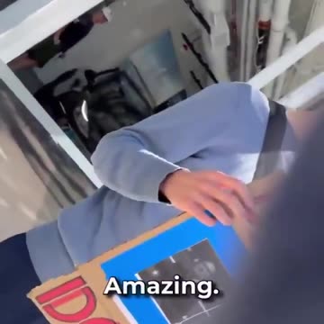 Protestor outside of Tesla Dealership: Yeah, I get paid to be out here.