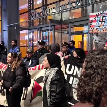 "HANDS OFF PALESTINE" in front of The New York Times.