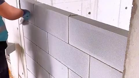 The satisfying process of building a brick wall!.hd