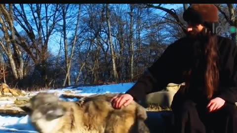 Pure hearts know each other. This shows when a wolf befriends this Serbian orthodox monk, God bless.