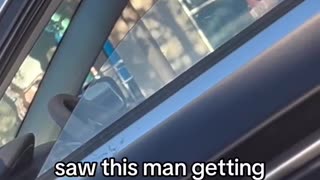 Man being serenaded by his wife in the car