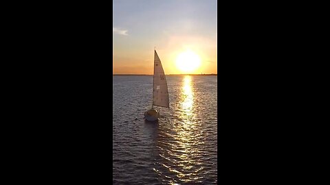 Sailing into the sunset drone view