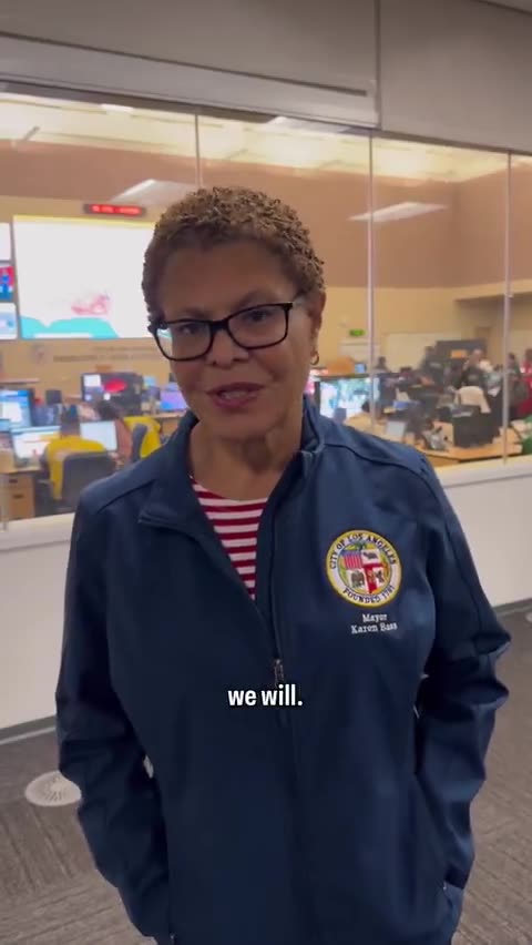 Mayor Karen Bass smiles while praising fire fighters, first responders for battling fires.