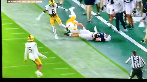 Penn State #44 Tyler Warren slams his head on the field.