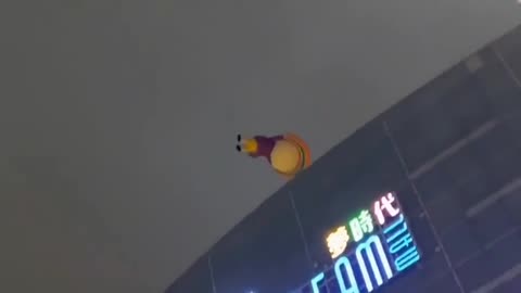 Goodbye Cruel World - Taiwan 7-Eleven mascot Open-chan flies away.