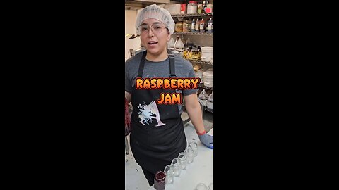 Making and hand pouring raspberry jam.