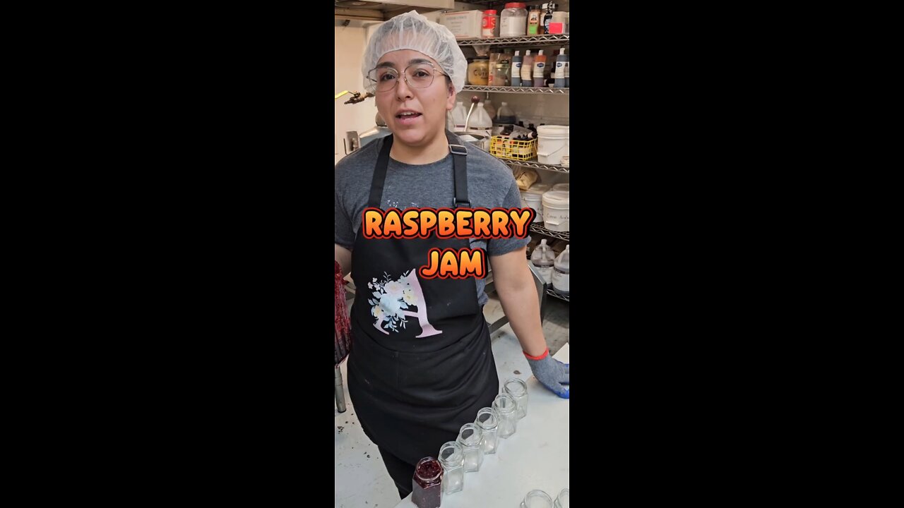 Making and hand pouring raspberry jam.