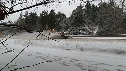 Snow plows flying bye on a snow day