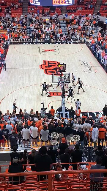 Oklahoma State beats Iowa State 74-68 and Cowboy fans storm the court.