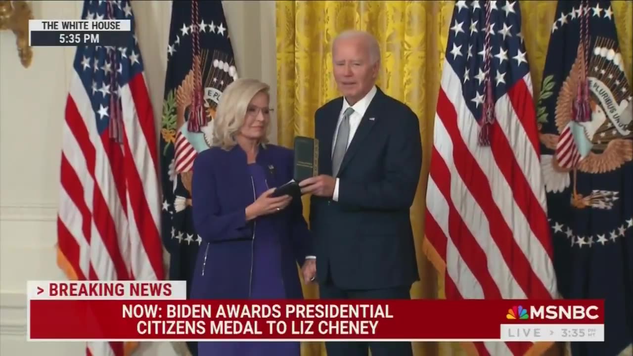 WATCH: Biden awards the Presidential Citizens Medal to Liz Cheney & refuses to let go of her hand 😬