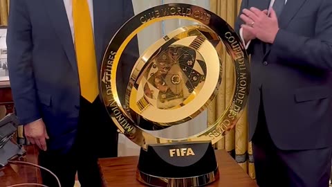 US President Donald Trump & FIFA President Gianni Infantino present the FIFA Club World Cup Trophy.