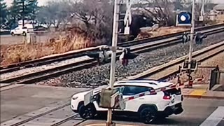 Train hits car, driver narrowly escapes