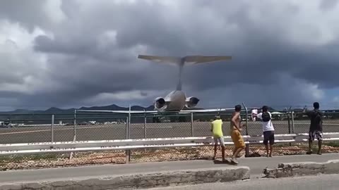 Tourists get blown away by an MD80 Series Aircraft takeoff at St. Martin Airport.