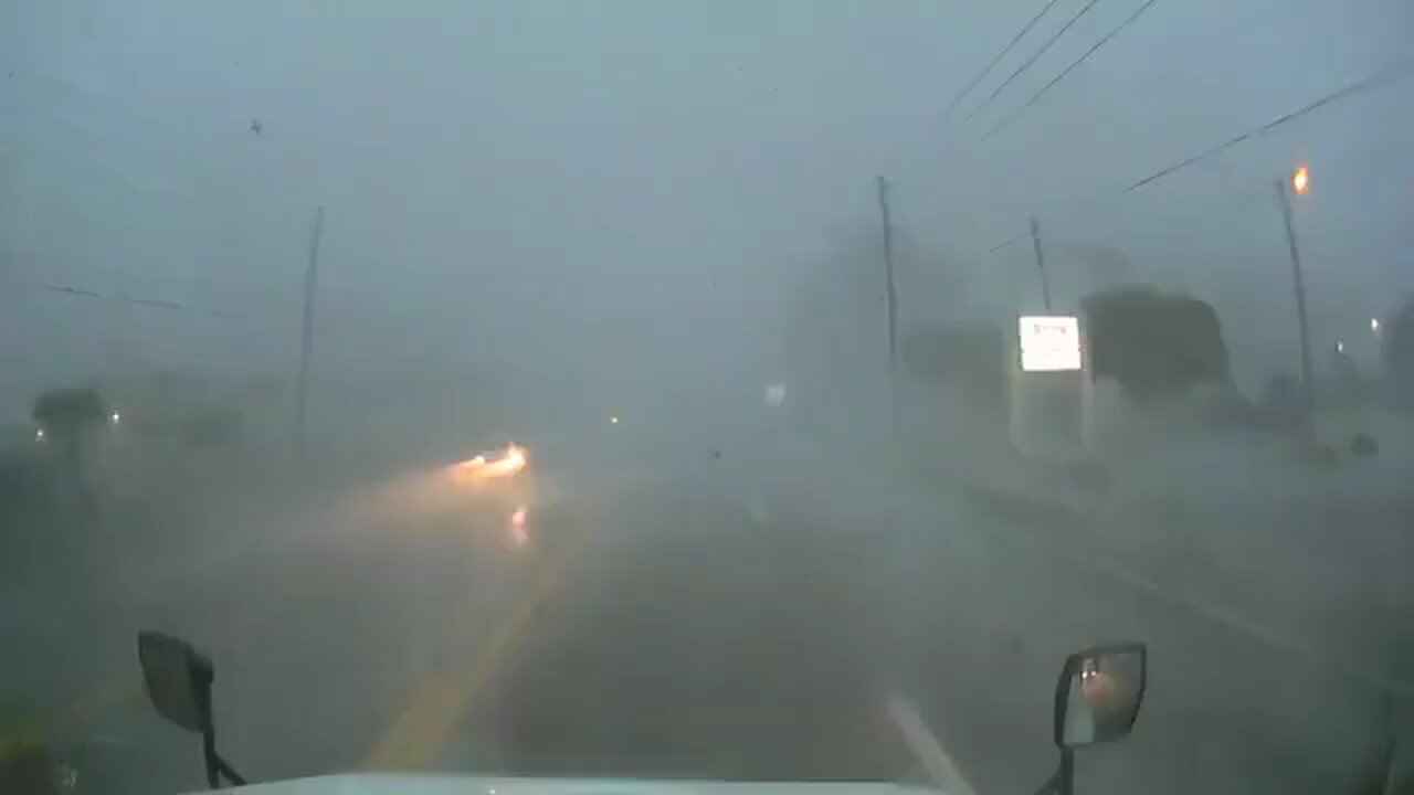 Tractor Trailer/Semi Truck Driving Through A hurricane. WOW