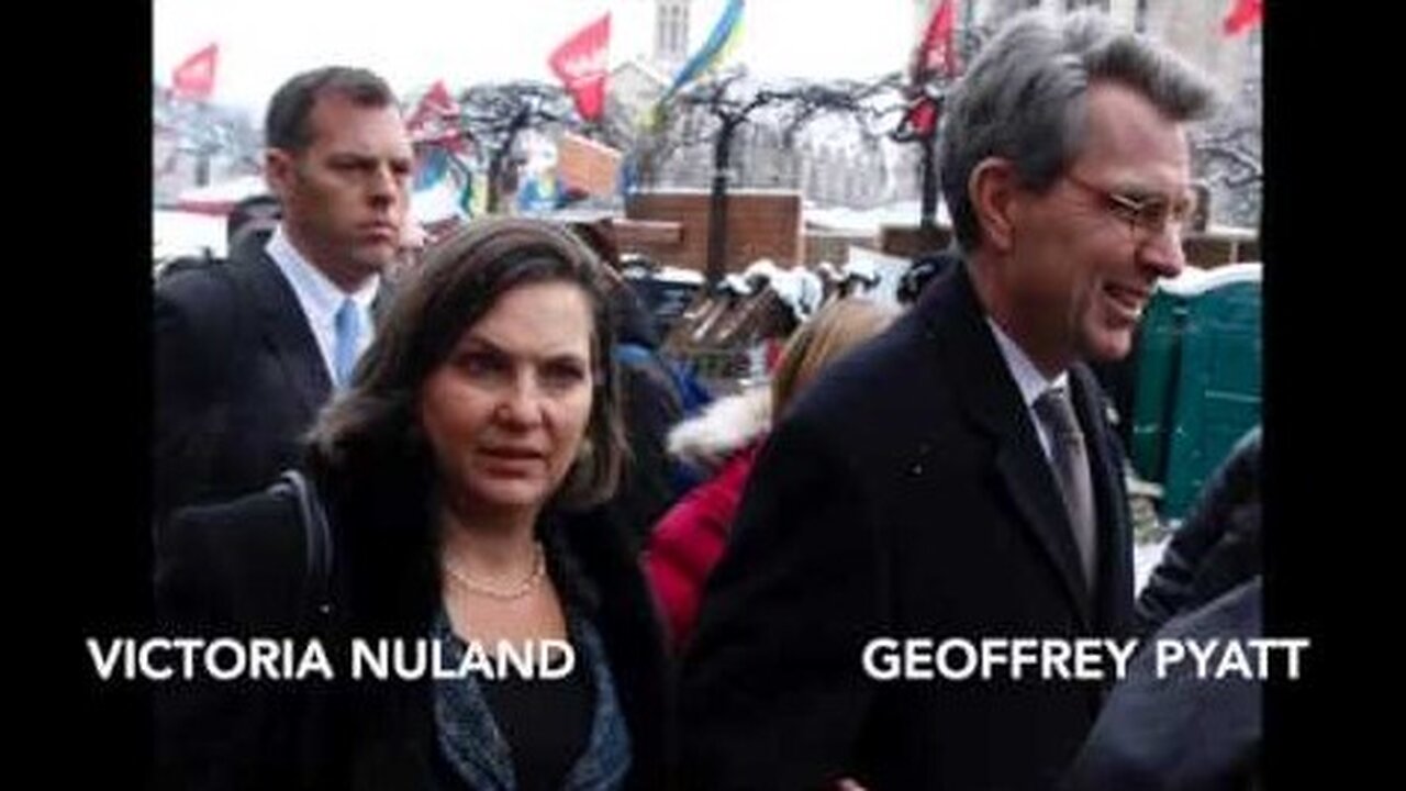 (February 2014) Maidan Square: John McCain filming the protests, standing alongside Geoffrey Pyatt (US ambassador to Ukraine) with Victoria Nuland standing behind him.