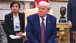 Katlin Collins reacts to President Trump's mug shot by the entrance of the oval office.