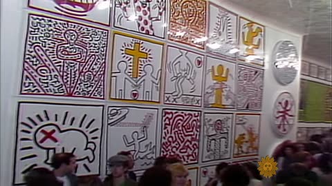 1982, Charles Osgood introduces the world to Keith Haring, a subway graffiti artist