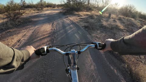 Scenic Bike Ride Through the Desert at Sunset