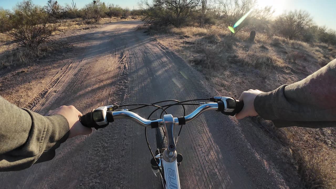 Scenic Bike Ride Through the Desert at Sunset