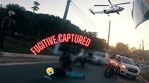 Fugitive falls, gets up and continues his escape on a high-powered motorcycle