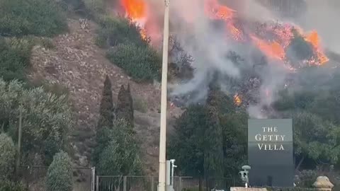 30k people flee the kill box as flames reach the getty museum....