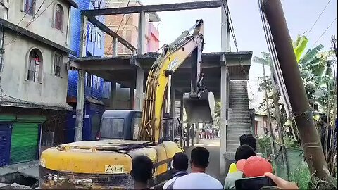 destroying community hall that build in middle of the road