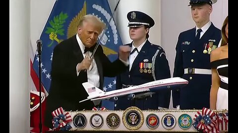 Donald Trump dances at inaugural ball with a SWORD in his hand